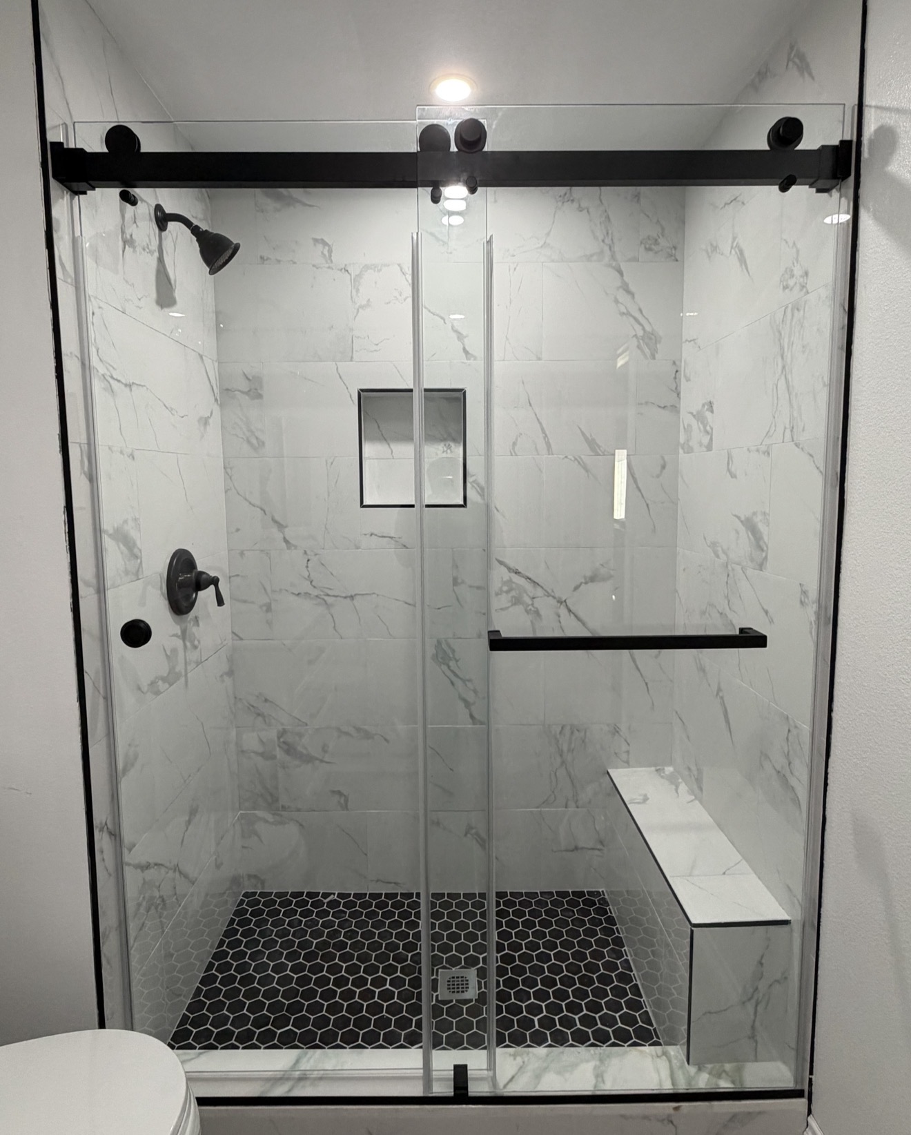Marble & Matte Black Bypass — Shower Doors